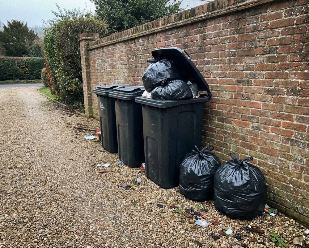 Overflowing wheelie bins in Felpham needing private collection